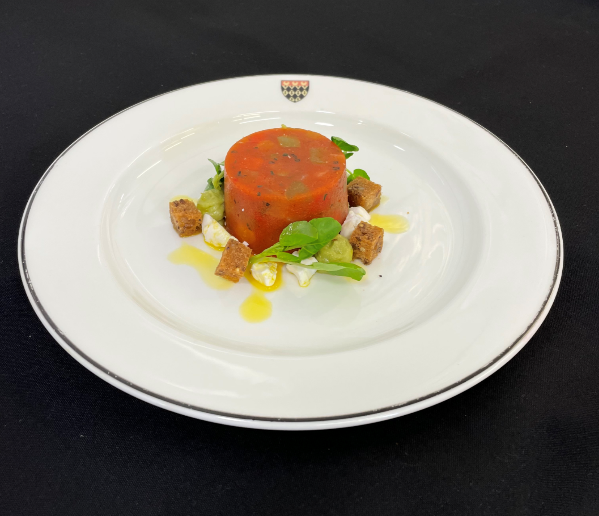 Mediterranean vegetable gazpacho terrine (vg) served with avocado, vegan feta and pea shoots