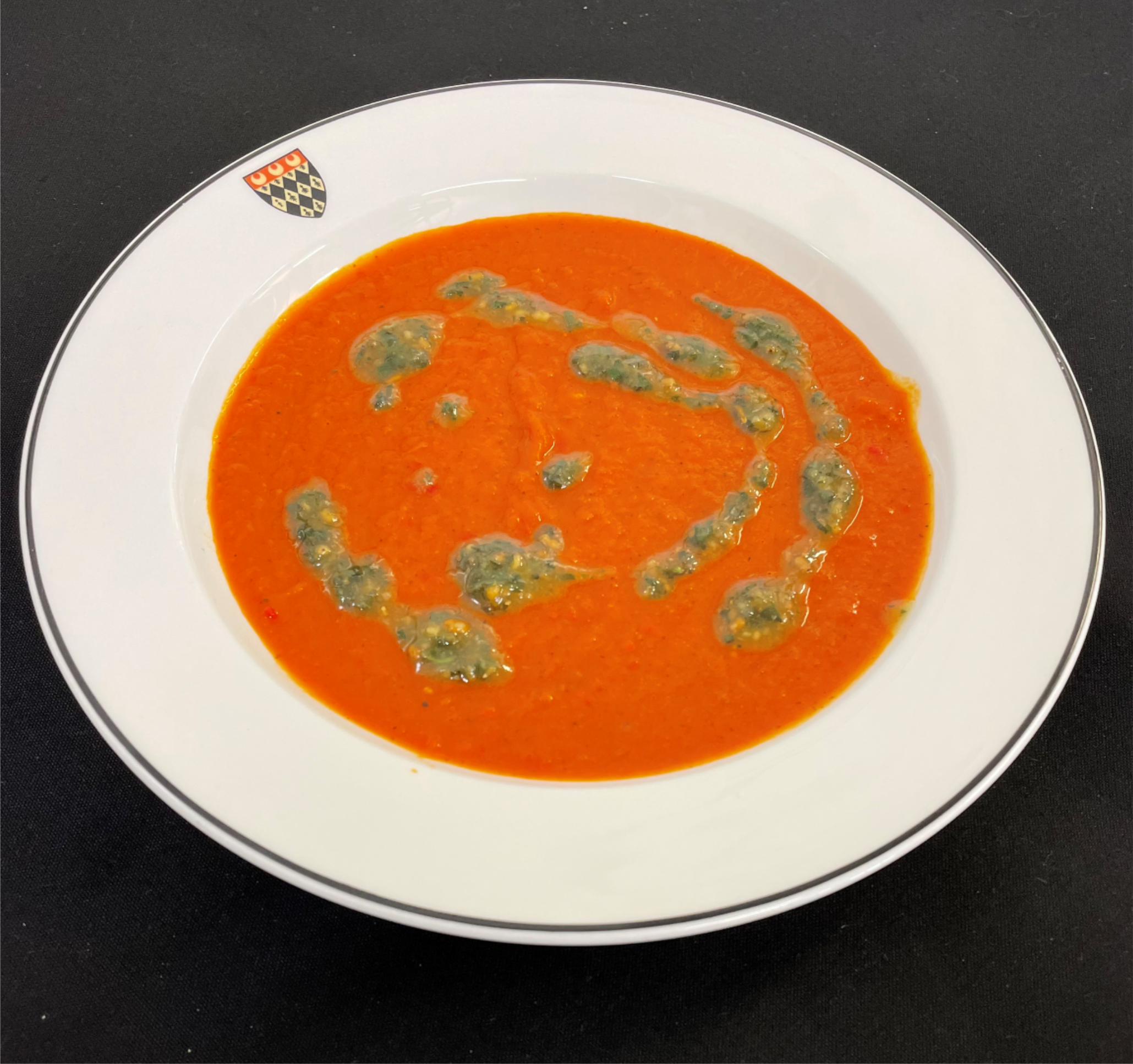 Red pepper and tomato soup (vg) served with a vegan pesto